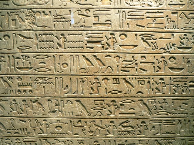 Egyptian hieroglyphs carved on a stone tablet